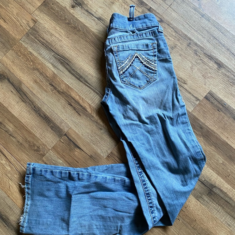 R.E.A.L. Mid Rise Stretch Whipstitch Boot Cut Jean
